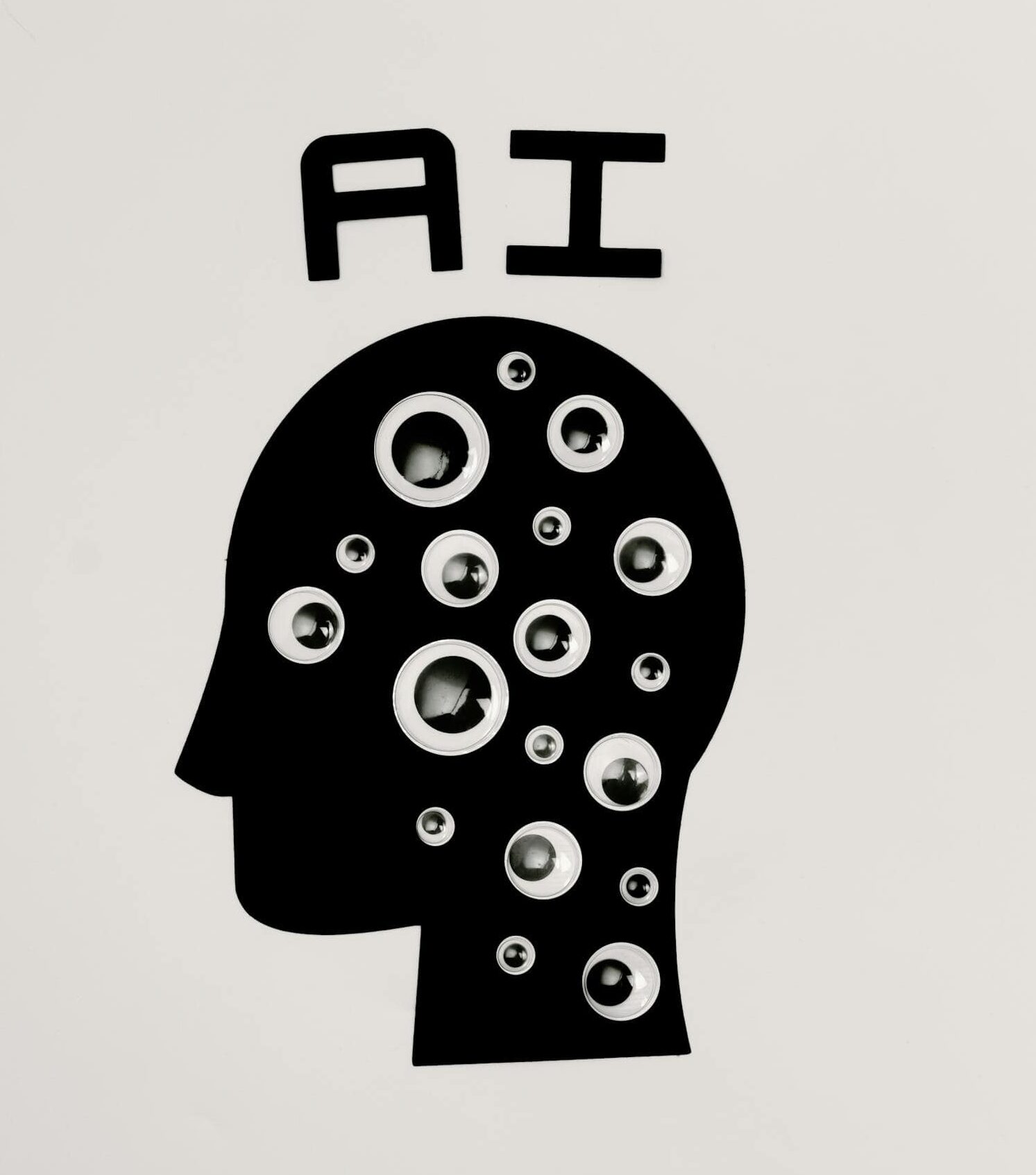 Abstract illustration of AI with silhouette head full of eyes, symbolizing observation and technology.